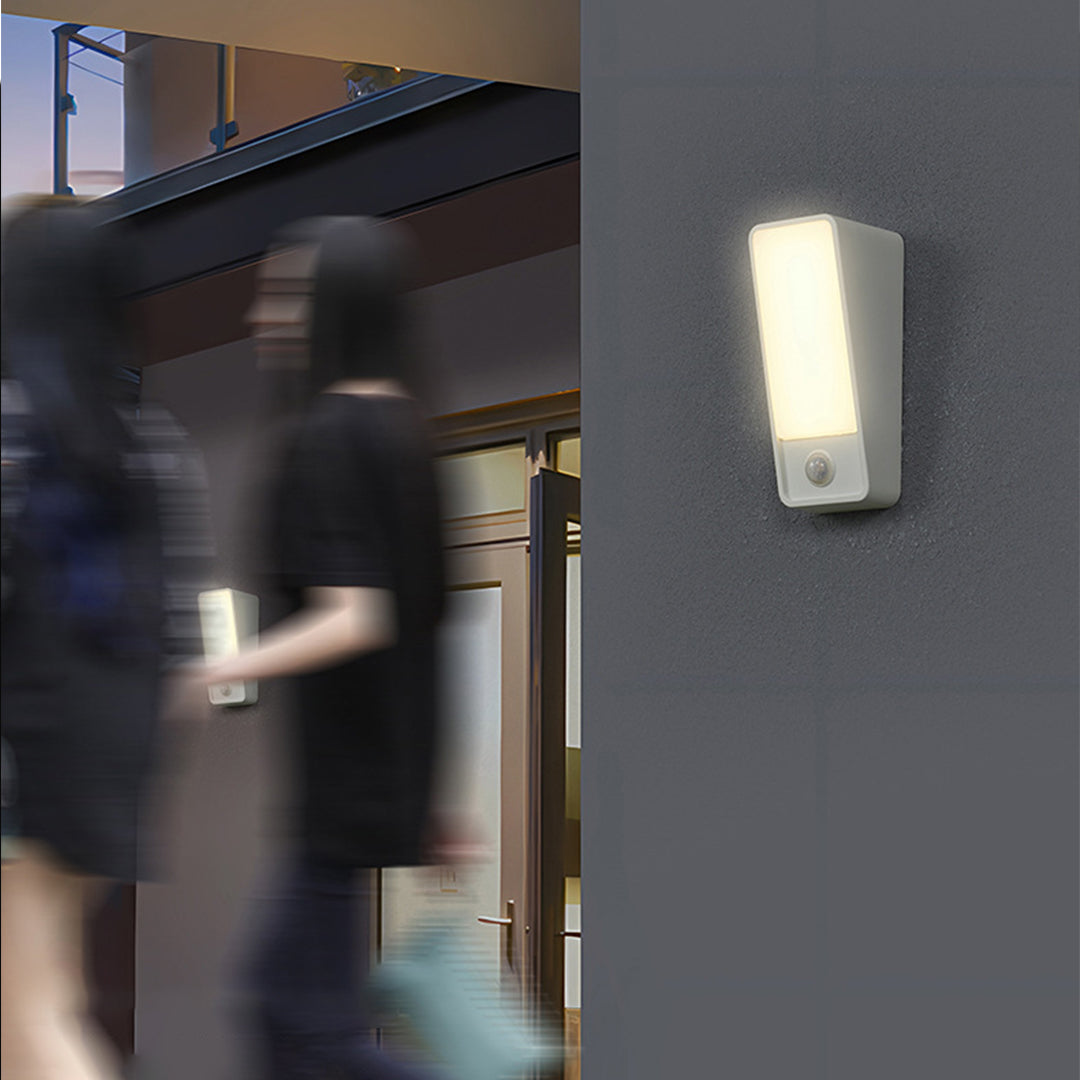 Architectural lighting installation showing wall sconce with motion blur effect