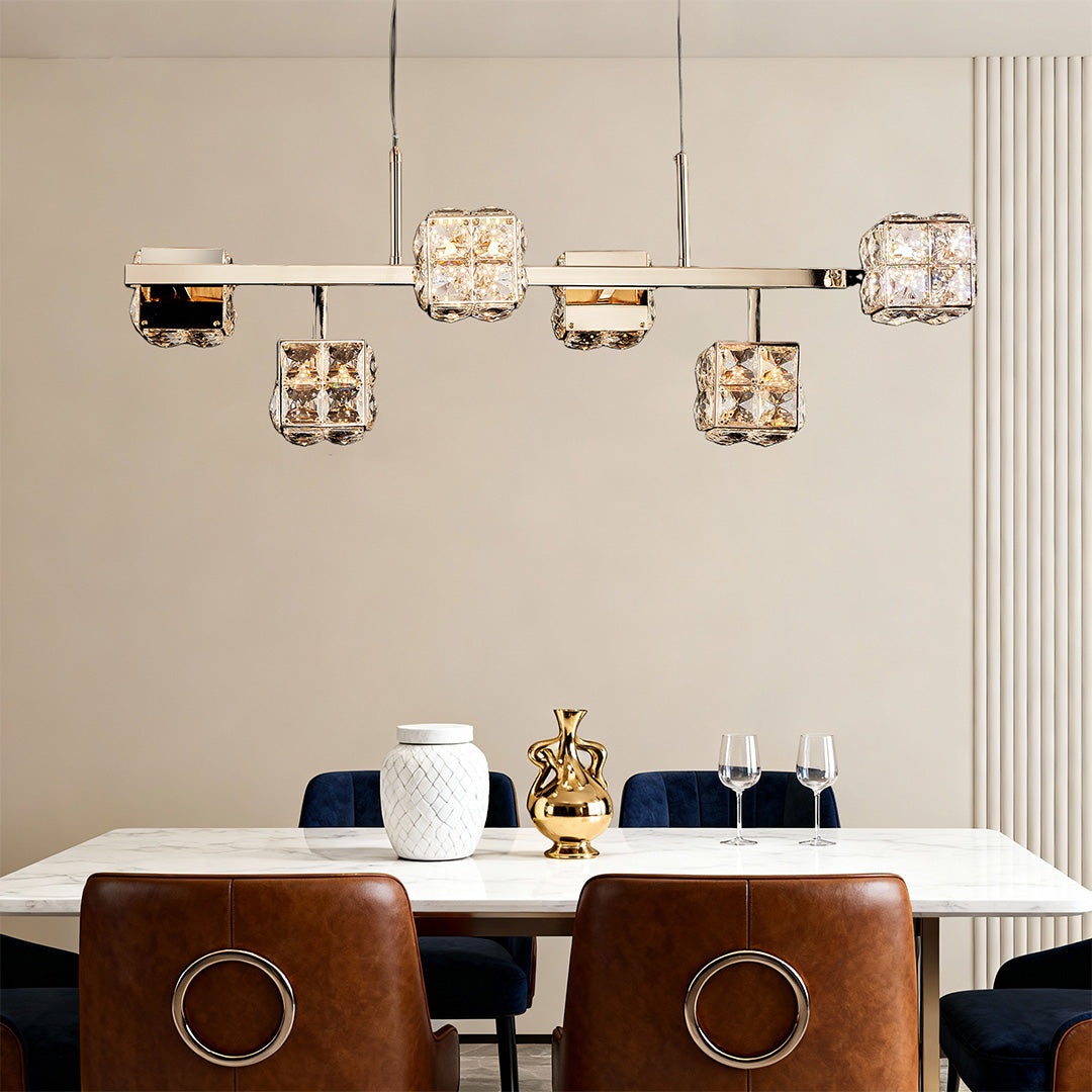 Architectural luxury chandeliers crystal featuring glass shade chandelier influence in horizontal configuration above glass dining table.