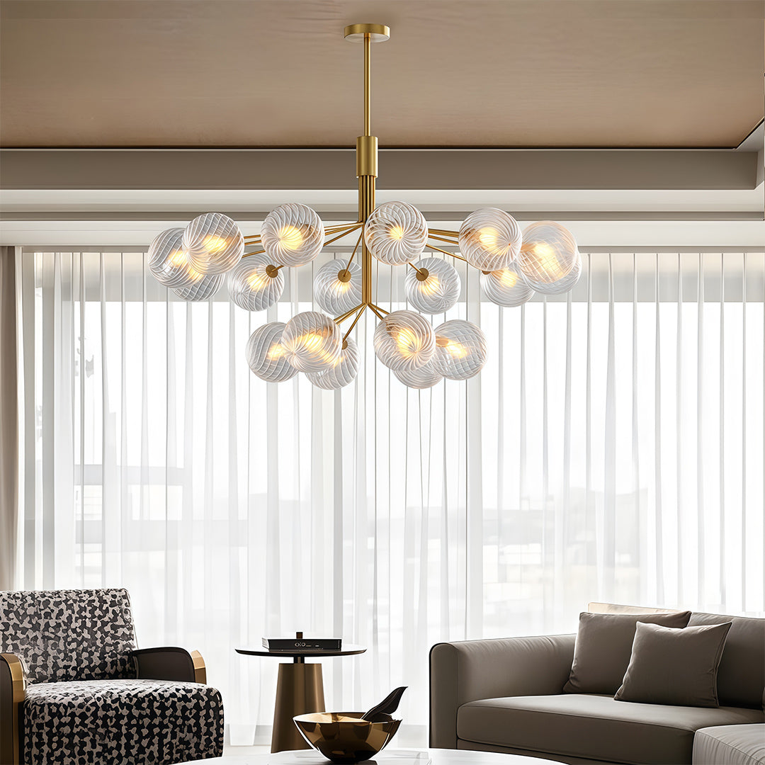 Architectural luxury modern chandeliers with glass shade chandelier styling creating dramatic lighting in elegant dining space.