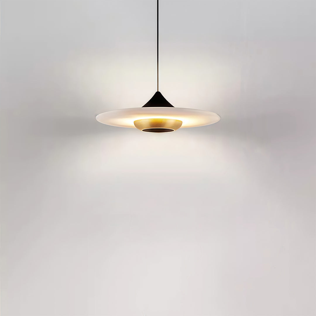 Architectural modern LED pendant lights featuring glass shade chandelier aesthetic providing soft illumination in minimalist white bedroom.