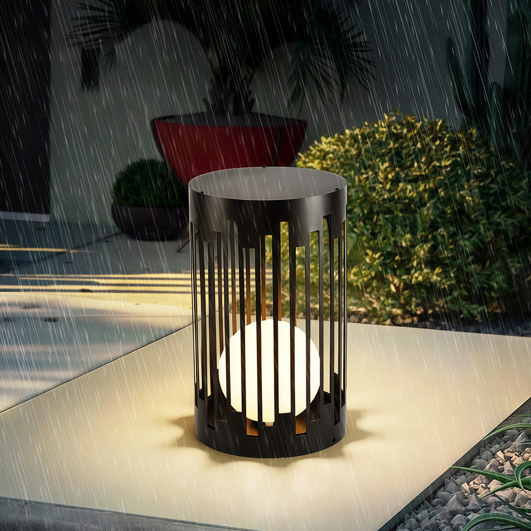 Architectural outdoor lantern light with glass shade chandelier styling creating warm ambient lighting on contemporary entrance walkway.