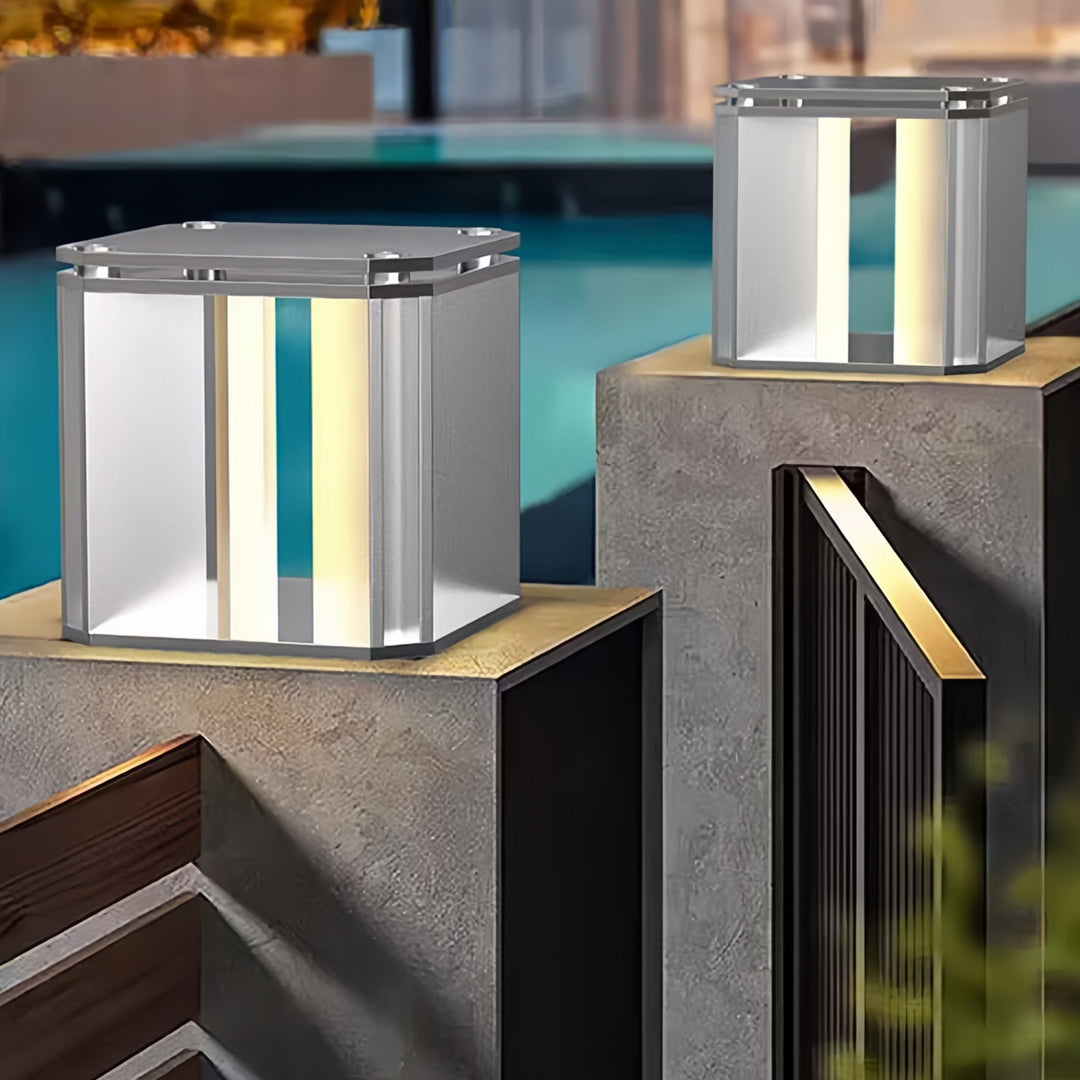 Modern architectural setting showcasing silver main gate pillar light design on structured exterior columns.