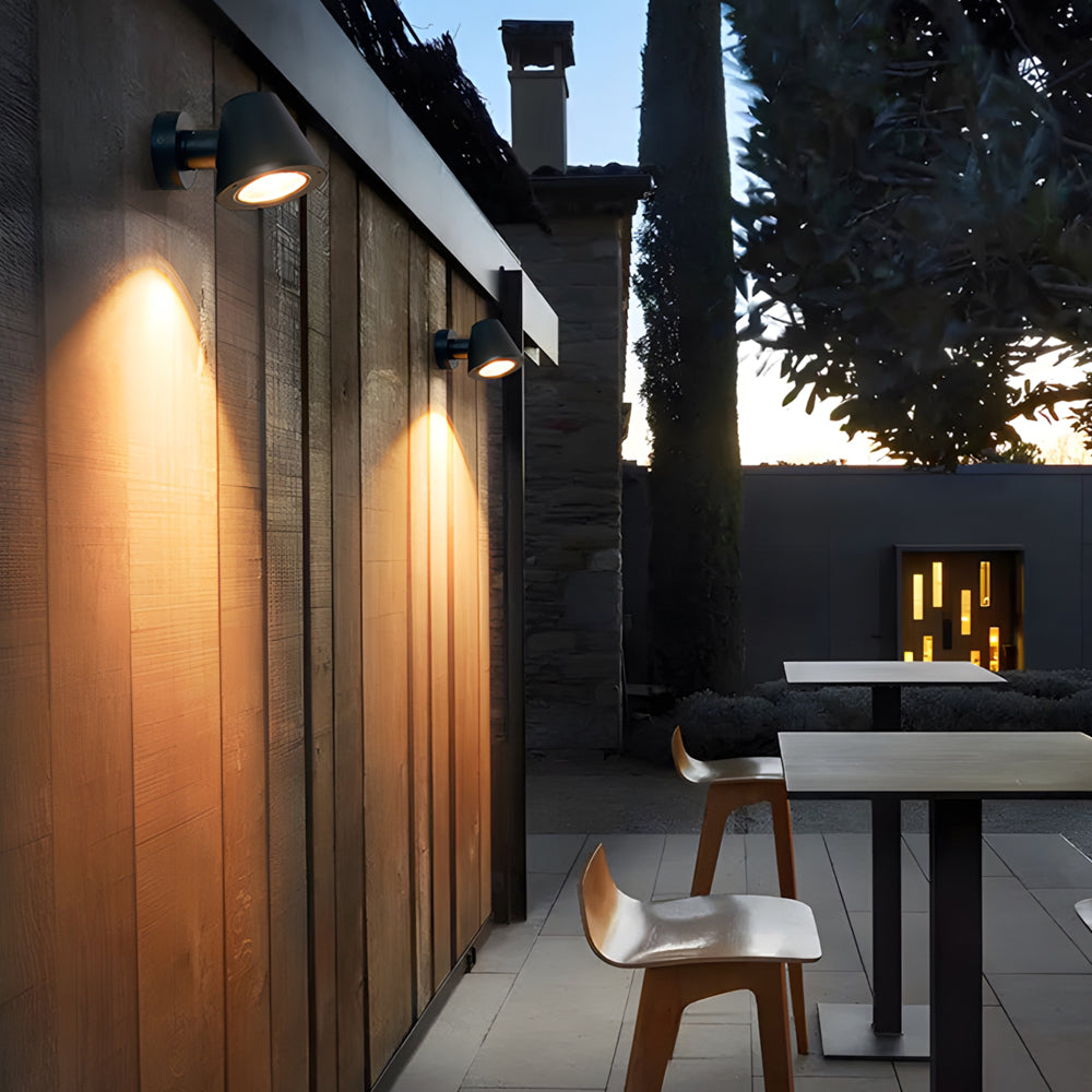 Architectural spot lights creating dramatic upward illumination on modern residential exterior walls