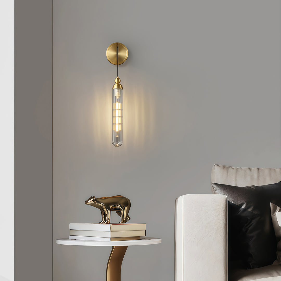 Architectural wall mount pendant light with glass shade chandelier styling creating ambient lighting above minimalist desk.