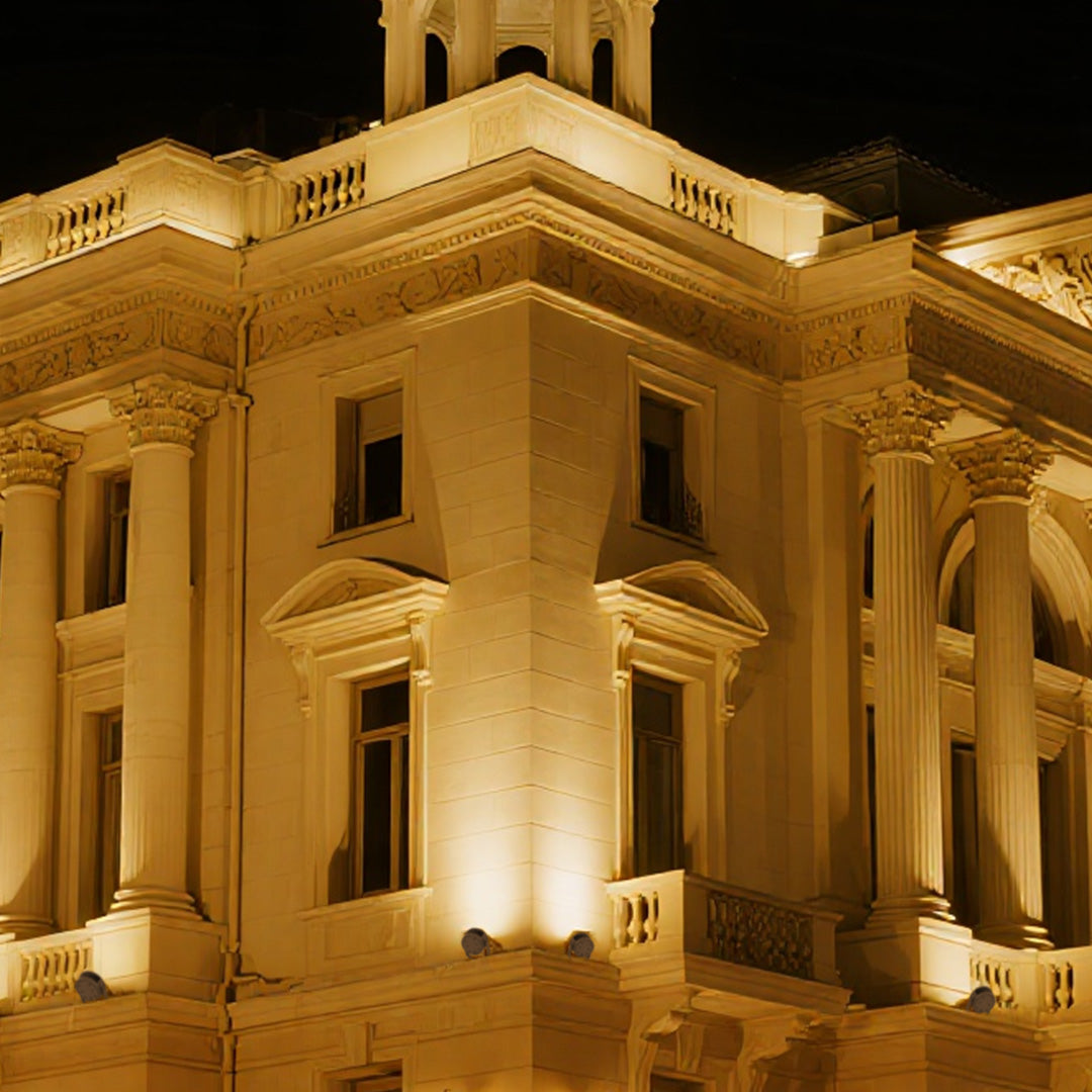Architectural waterproof LED spotlight creating dramatic uplighting effect on historic column structure