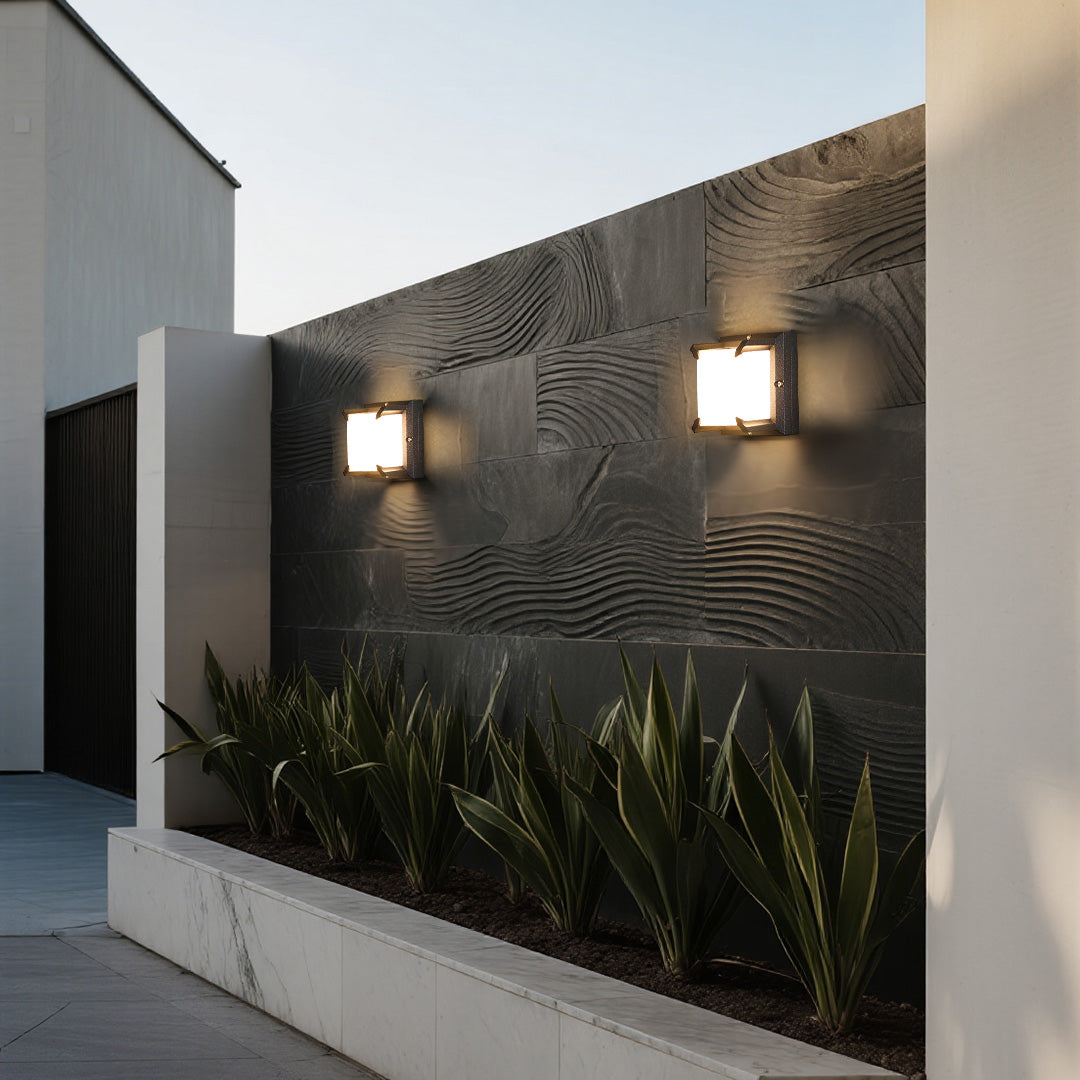 Architectural exterior with wavy slate texture and a pair of minimalist Black Outdoor Wall Light fixtures.