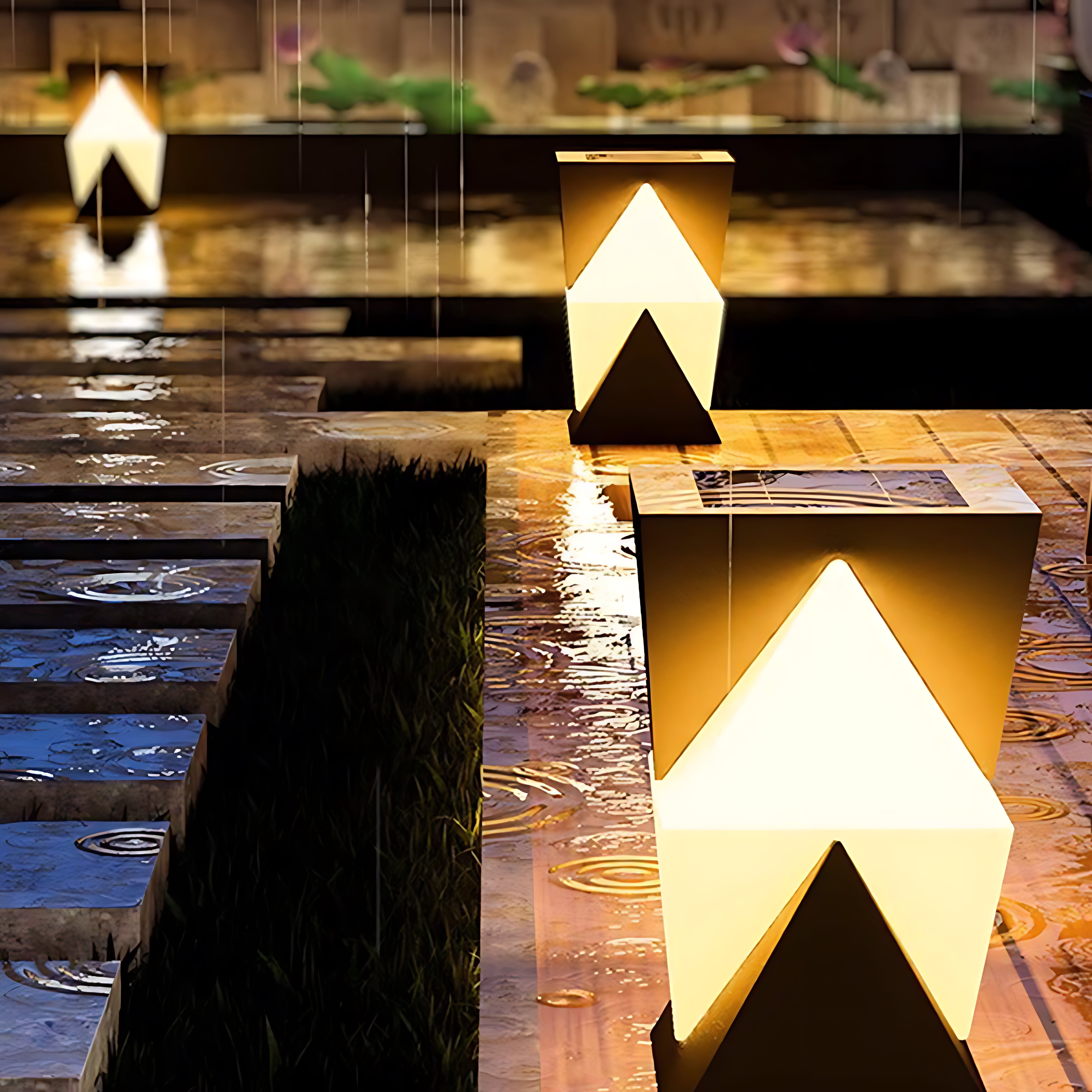 Arrow-shaped USB rechargeable table lamps creating striking architectural lighting on brick wall exterior