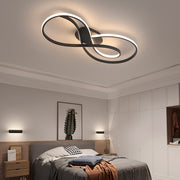 Art deco ceiling light flush mount illuminating elegant bedroom with brown bedding