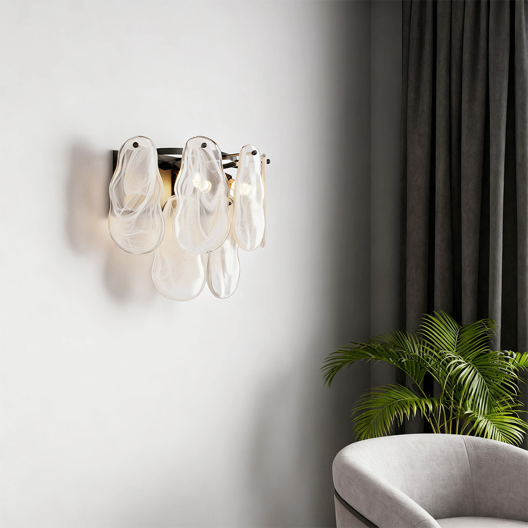 Modern luxury chandeliers style art deco wall lights above contemporary sofa in neutral interior