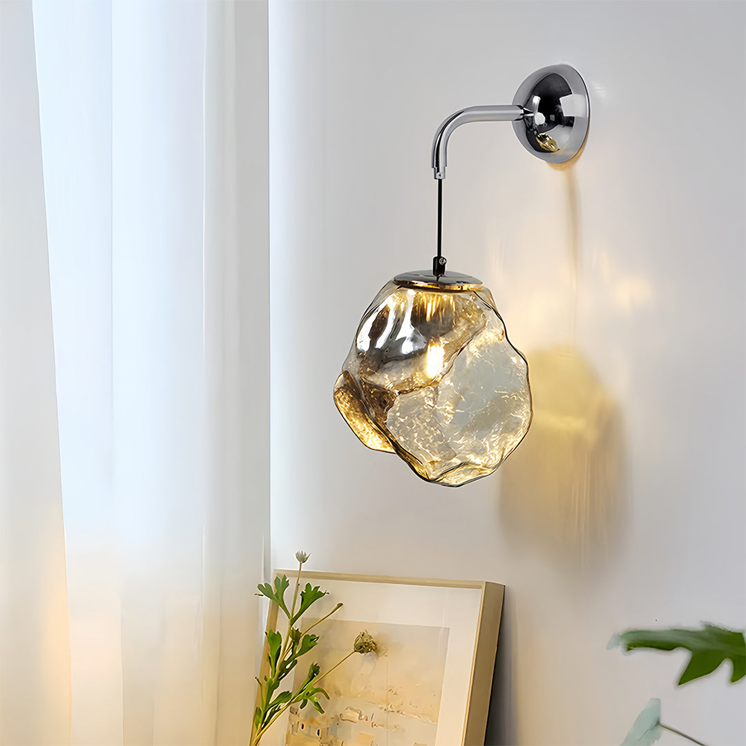Art deco wall sconce lighting providing accent illumination with geometric glass shade in bright interior space