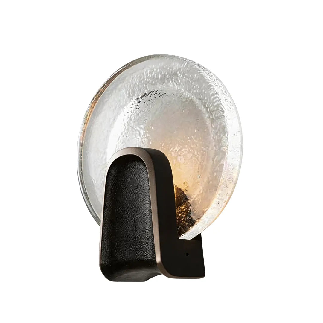 Art deco wall sconce lighting in Black-Clear with a round glass shade on a white background.