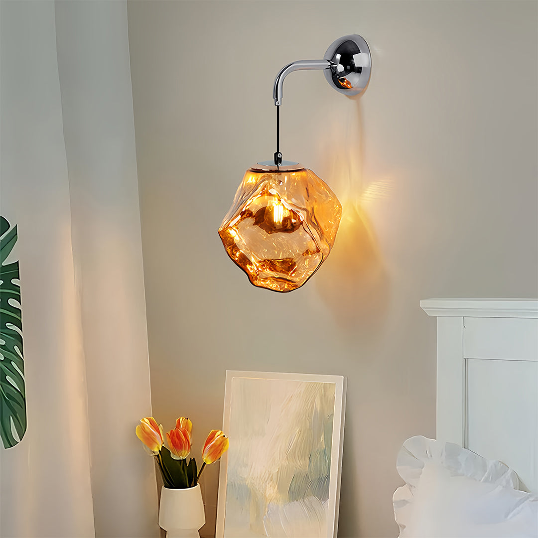 Art deco wall sconce lighting illuminating entryway with amber geometric shade creating inviting atmosphere
