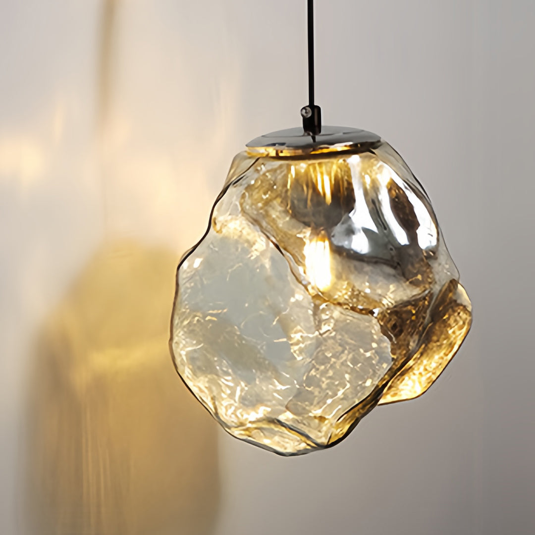 Art deco wall sconce lighting pendant featuring geometric glass shade with chrome hardware creating ambient illumination