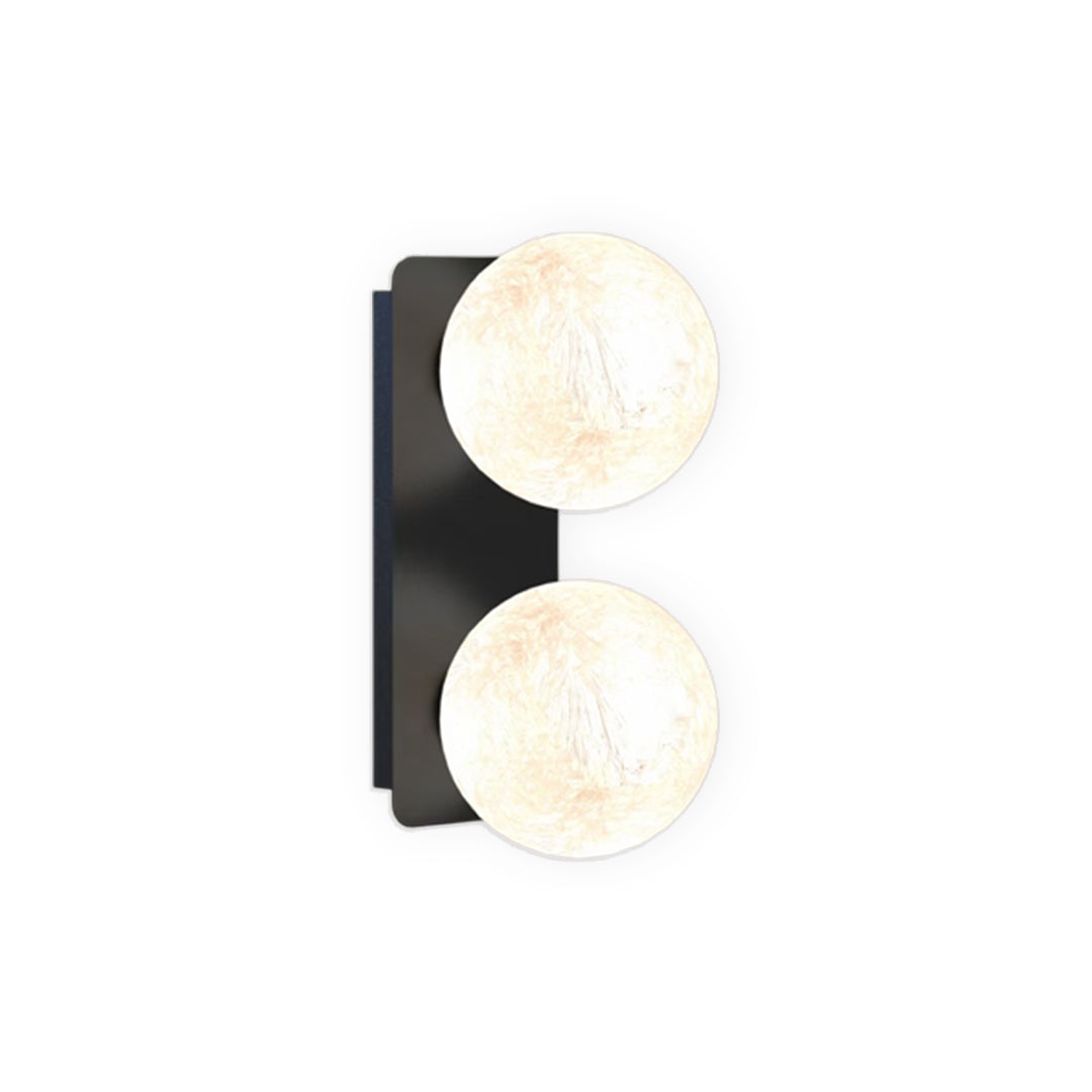 Two-light vertical art glass wall sconce with modern black frame.