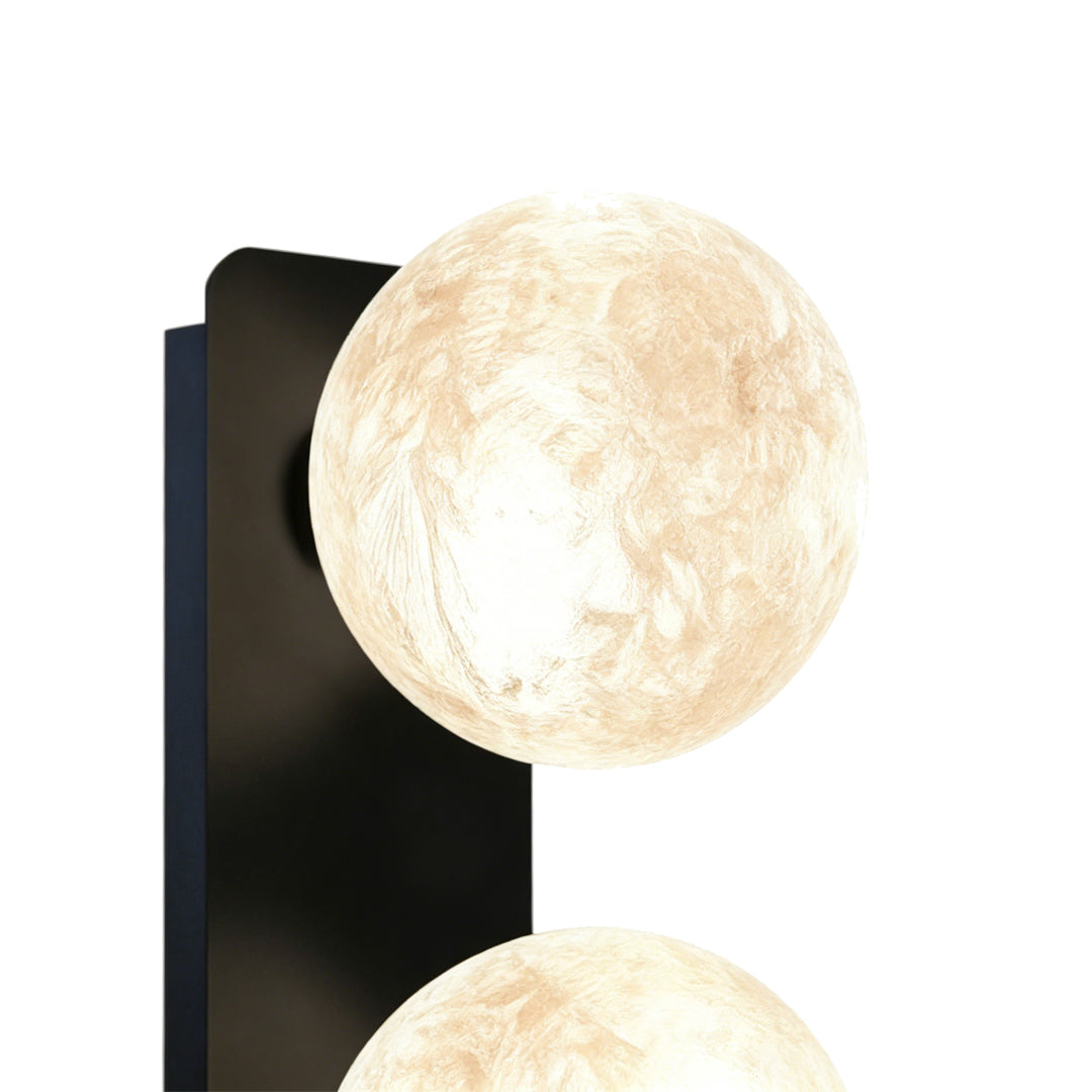 Close-up of textured art glass globe with warm diffused light.