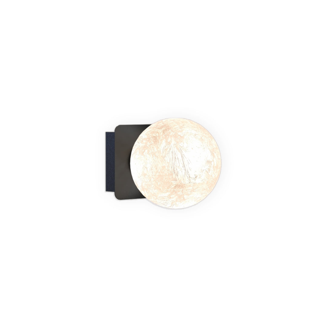 Single globe art glass wall sconce in minimalist design.