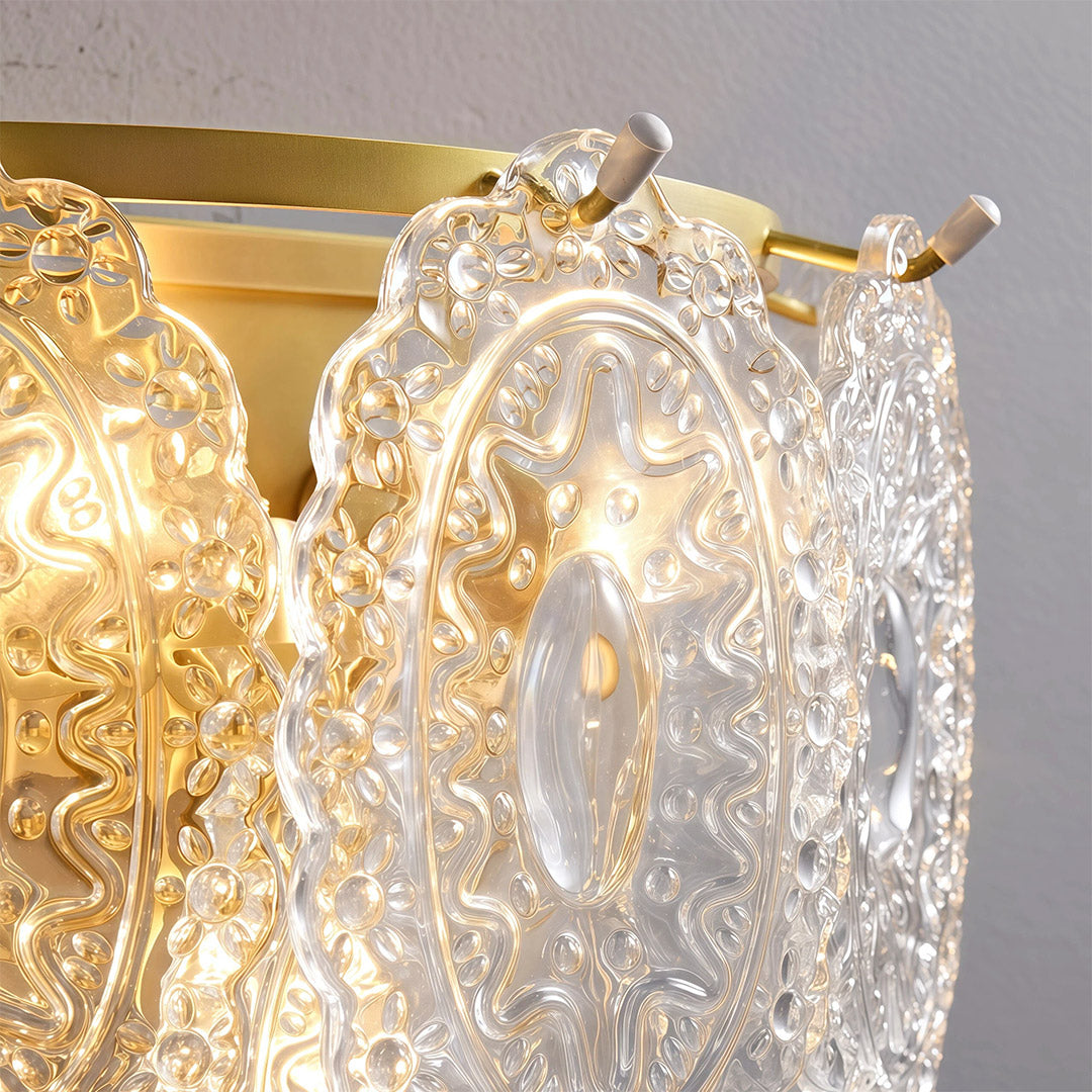 Art wall lights close-up detail showcasing intricate textured glass and brass metalwork