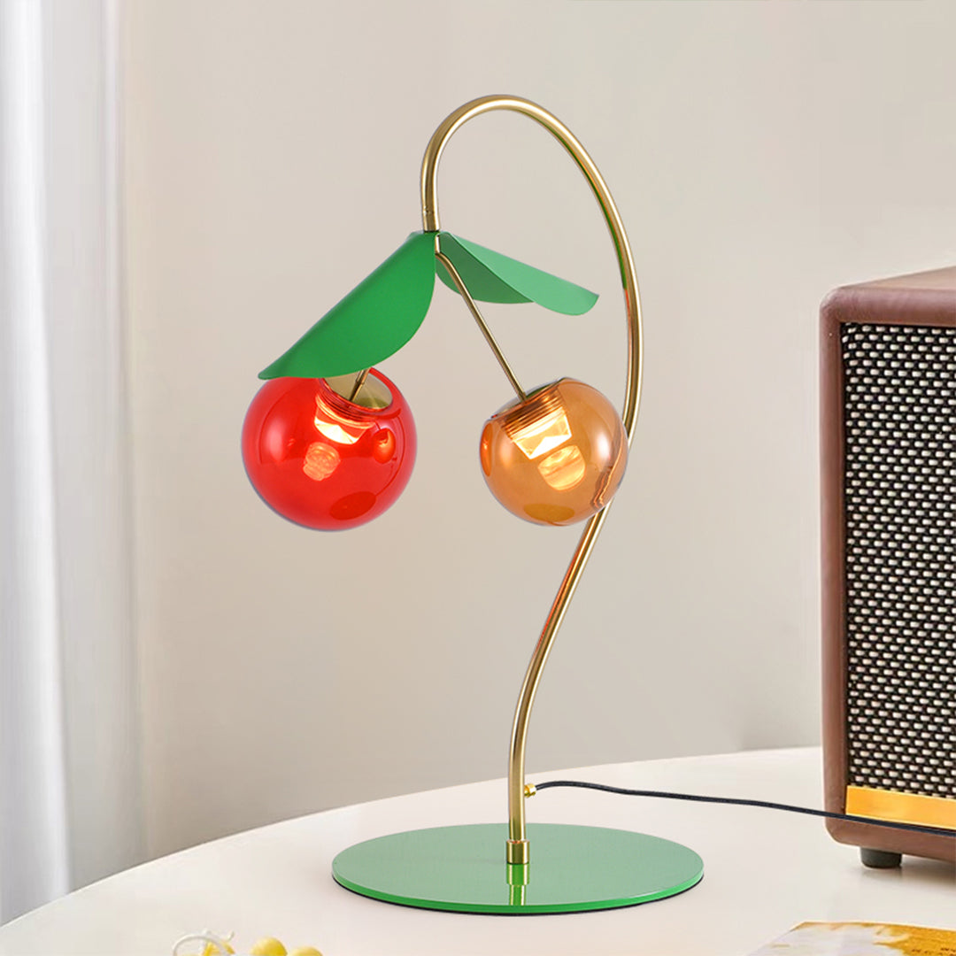 Artistic modern LED table lamps with cherry design positioned on contemporary workspace