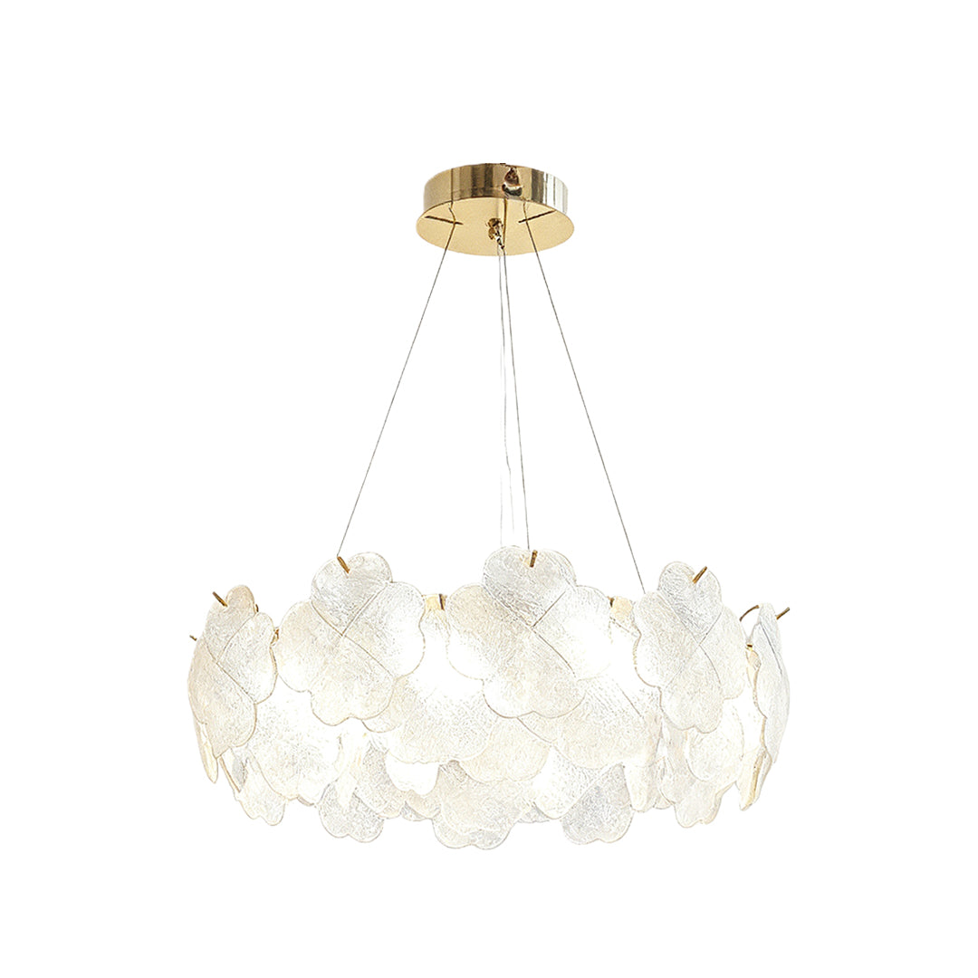 Artistic glass chandeliers installed in a sophisticated dining room, providing warm and ambient lighting