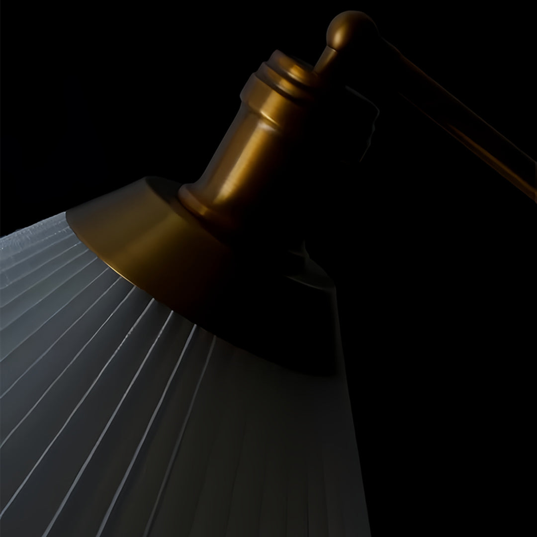 Artistic lighting shot of small black pendant light demonstrating adjustable positioning capabilities