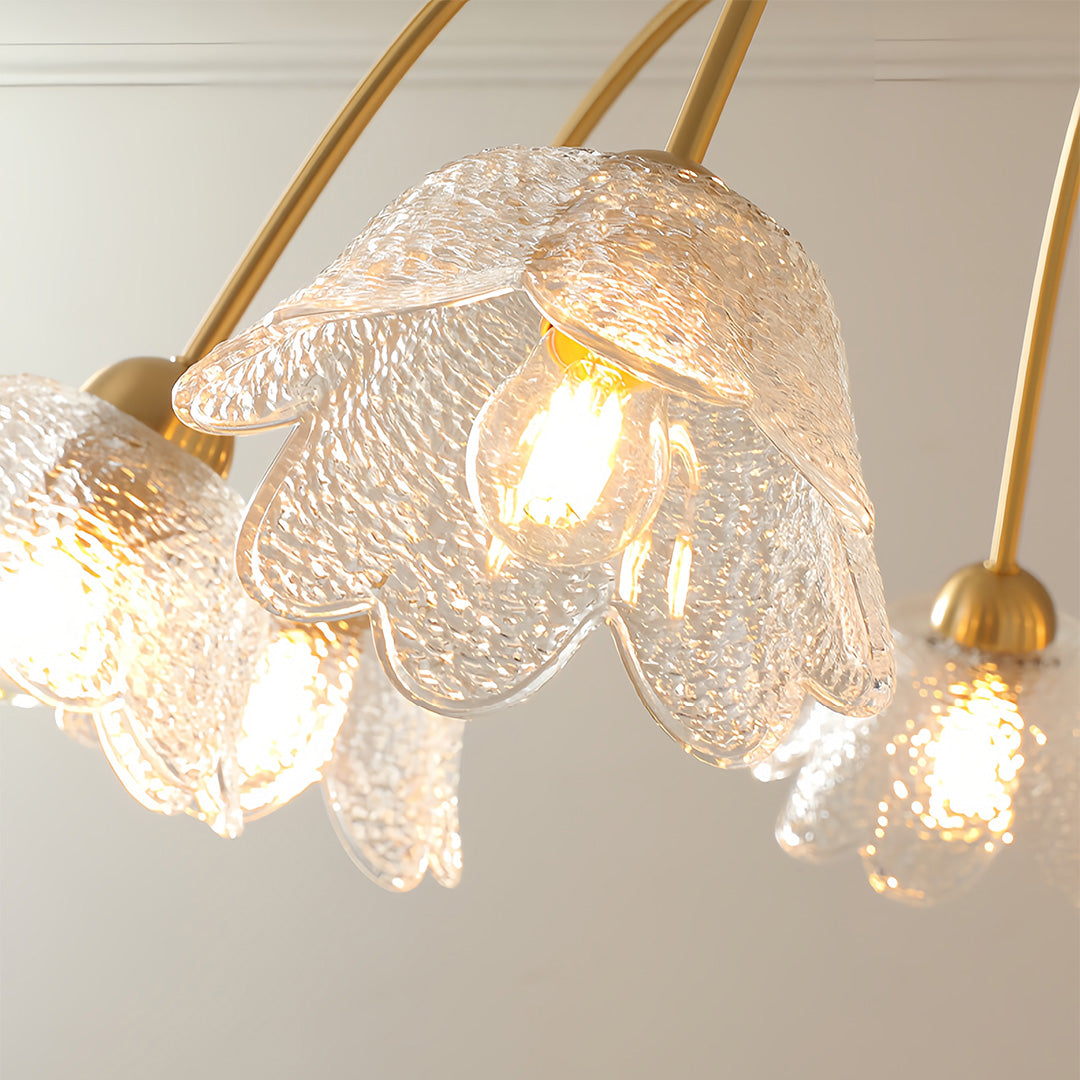 Artistic glass shades chandelier featuring unique textured glass elements with warm ambient lighting
