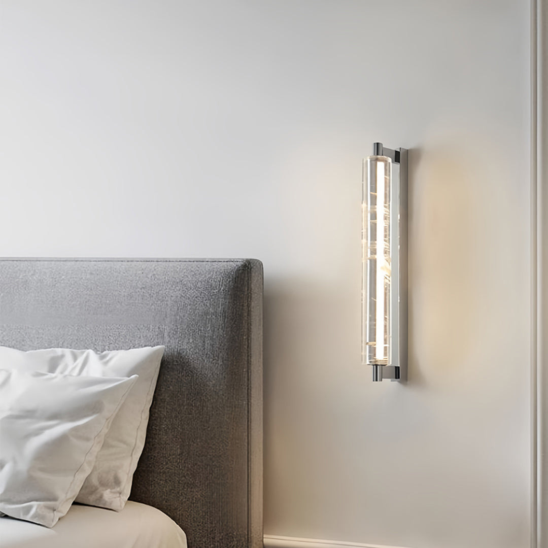 Artistic crystal pendant light displaying vertical crystal tube with integrated lighting system for contemporary wall mounting