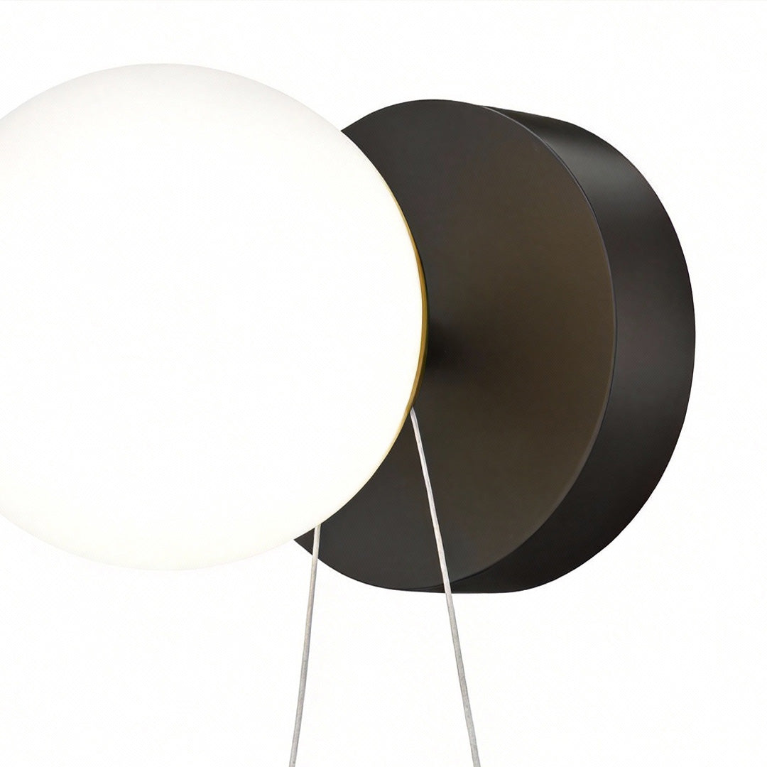 Astronaut wall light with a close-up view of the astronaut figure and circular light.