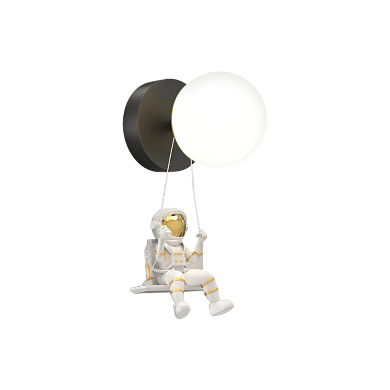 Astronaut wall light with dimensions, highlighting the astronaut and light structure.