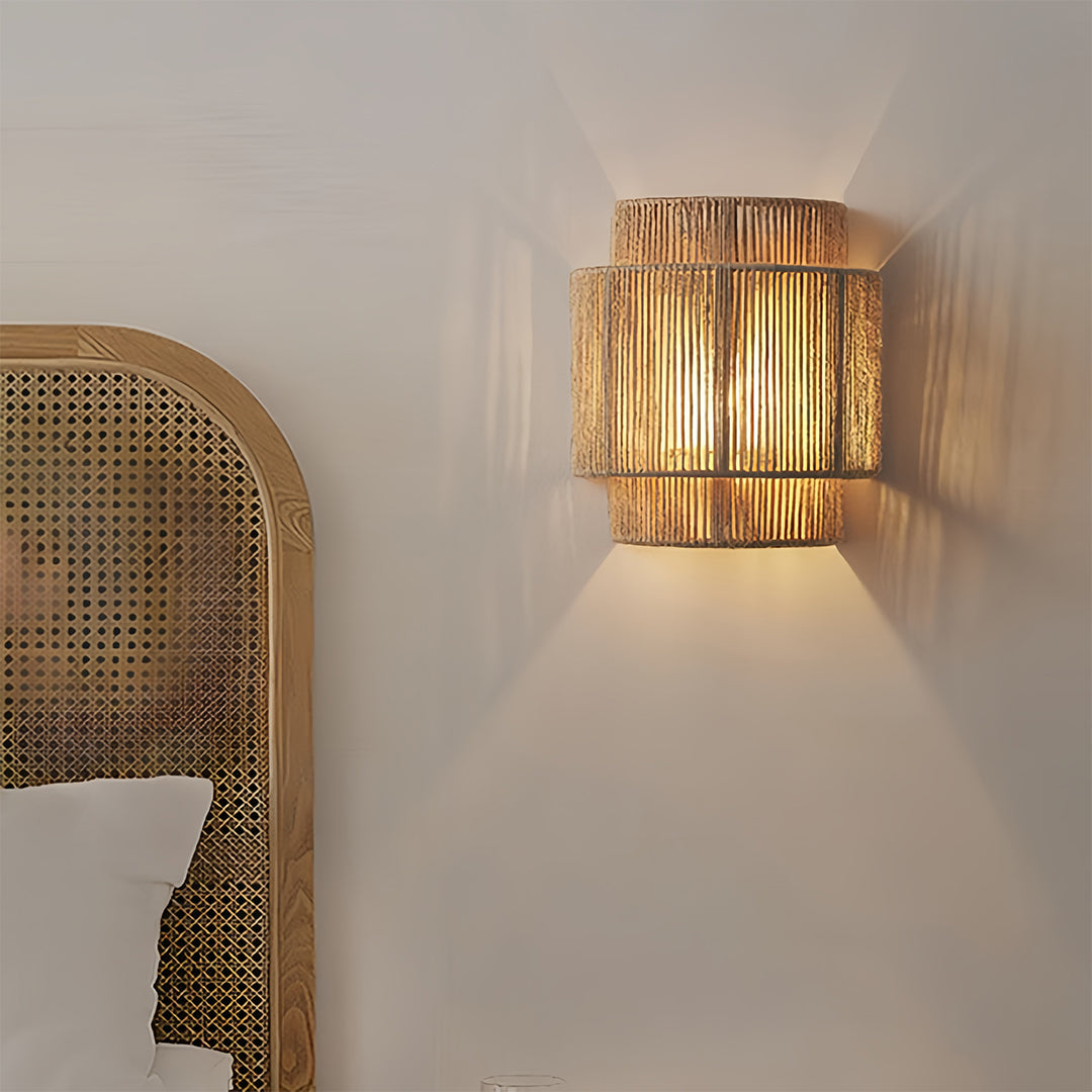 Japanese wall sconce light creating atmospheric lighting in modern interior with woven screen backdrop