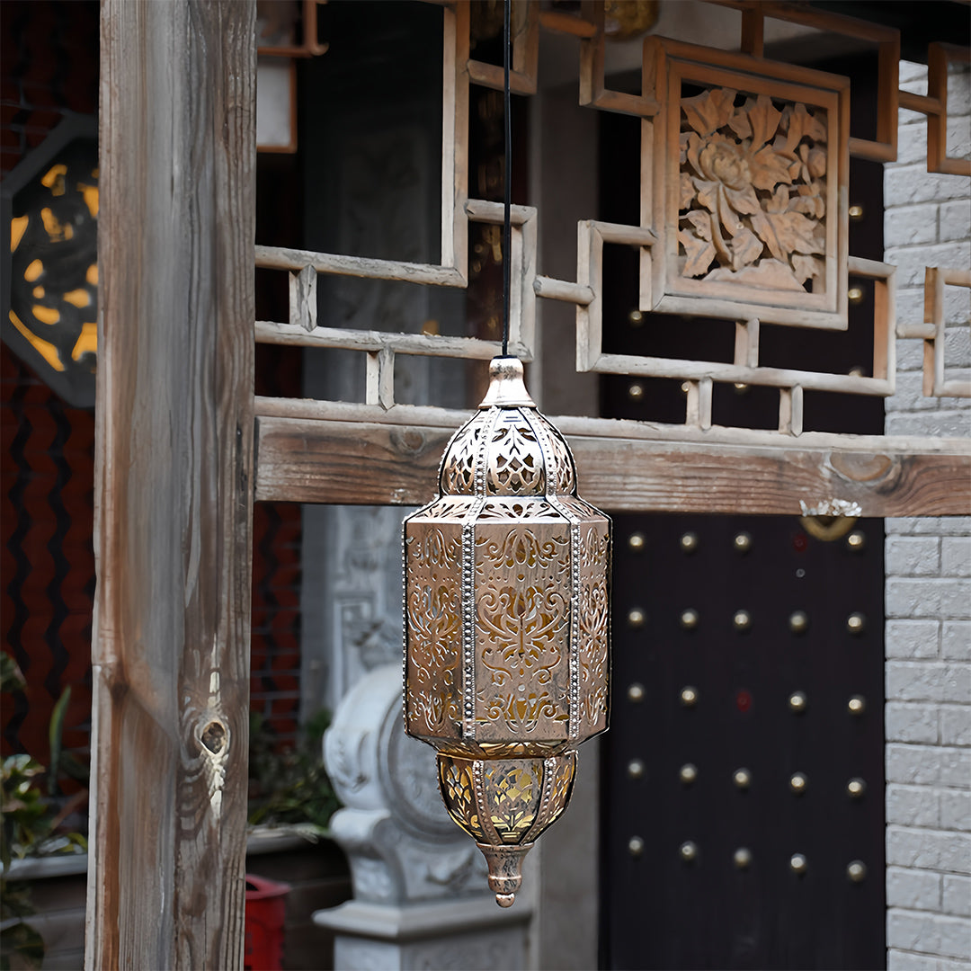 Authentic antique style outdoor moroccan lanterns with a hollow metal frame hanging on a traditional wood structure.