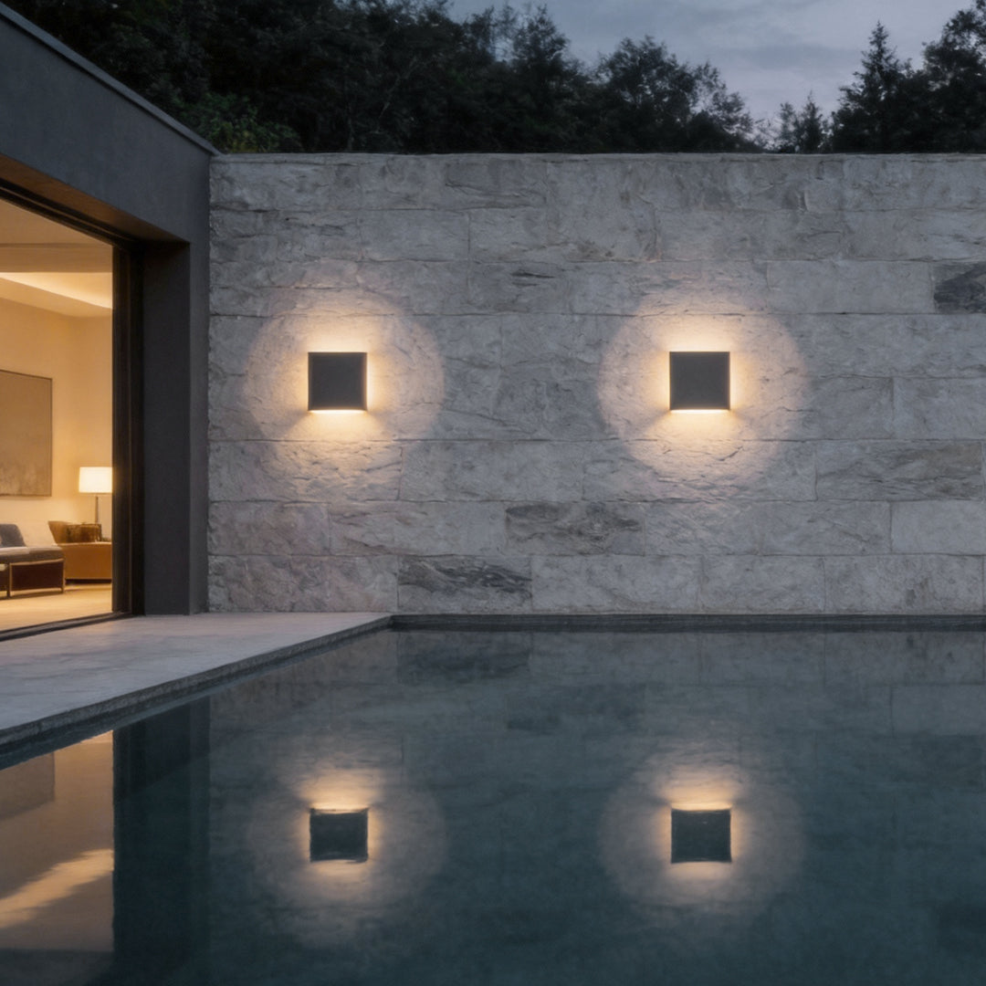 Backlit wall light installed on modern outdoor villa wall