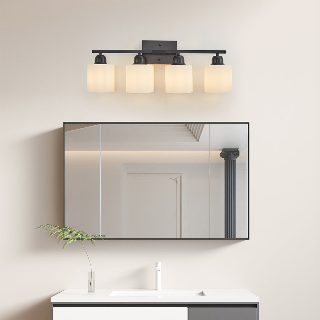 Modern bathroom vanity light with three bulbs and round mirrors, creating a balanced and stylish look.