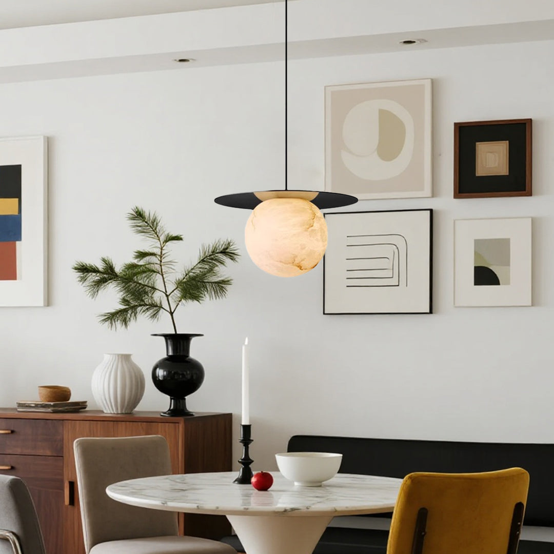 Ball pendant light with a white marble sphere, adding sophistication to a contemporary living space.