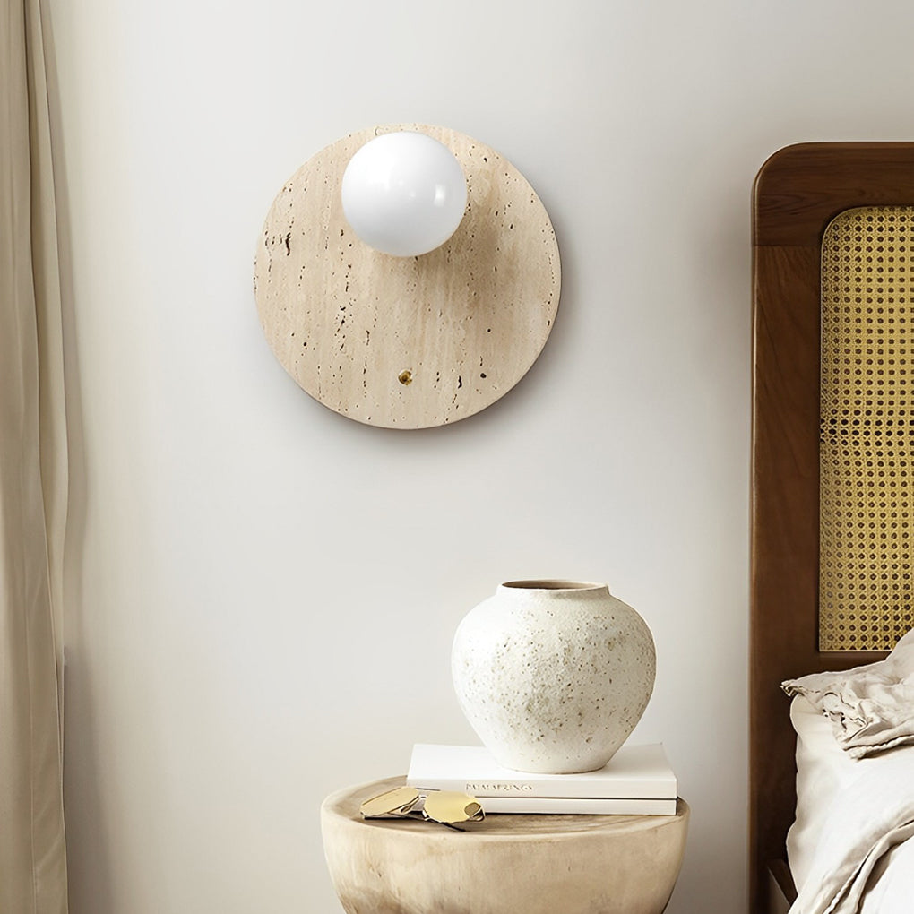 Ball wall lamp with a close-up of its round wooden shade and soft light.