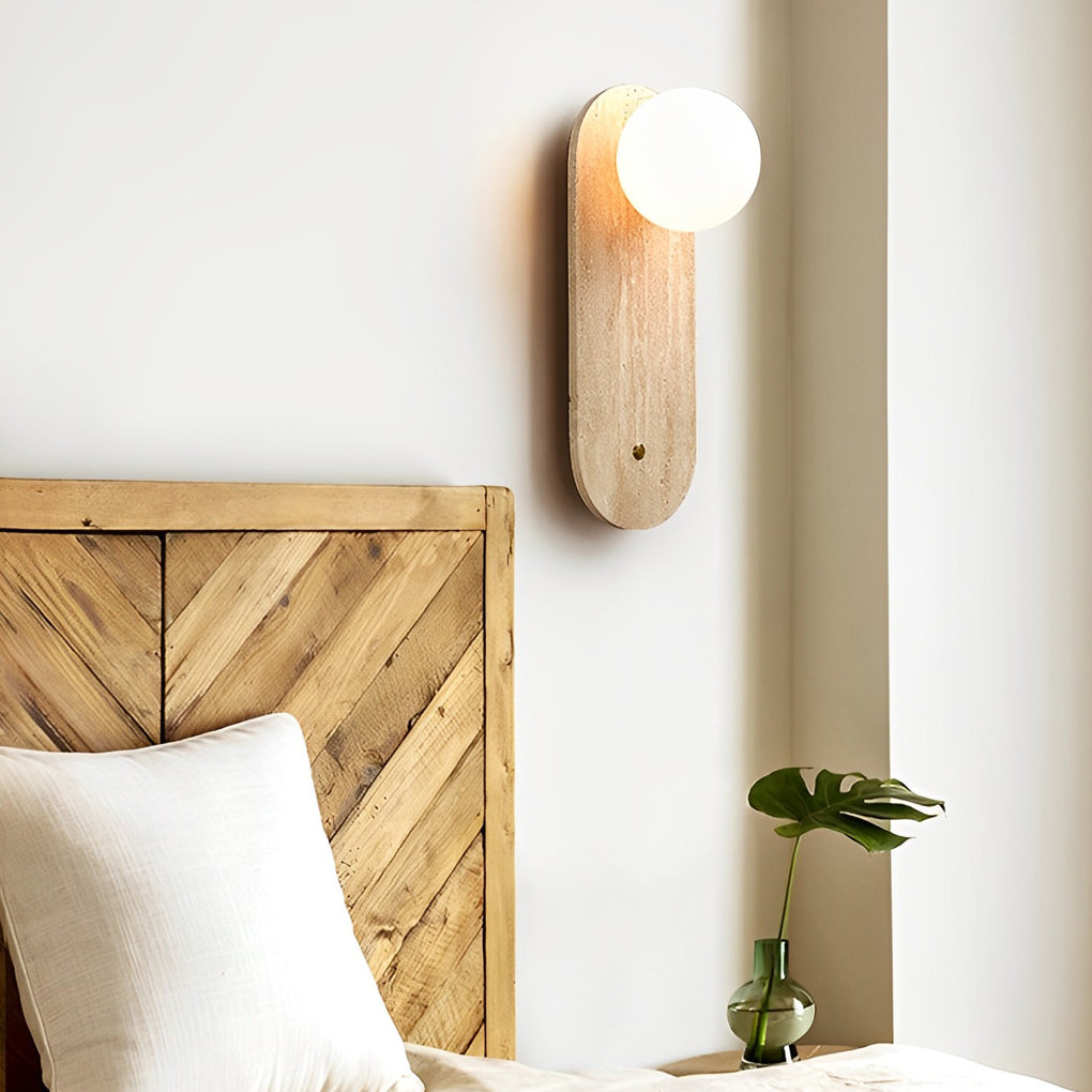 Ball wall lamp with a natural wooden texture, providing ambient light in a stylish interior.