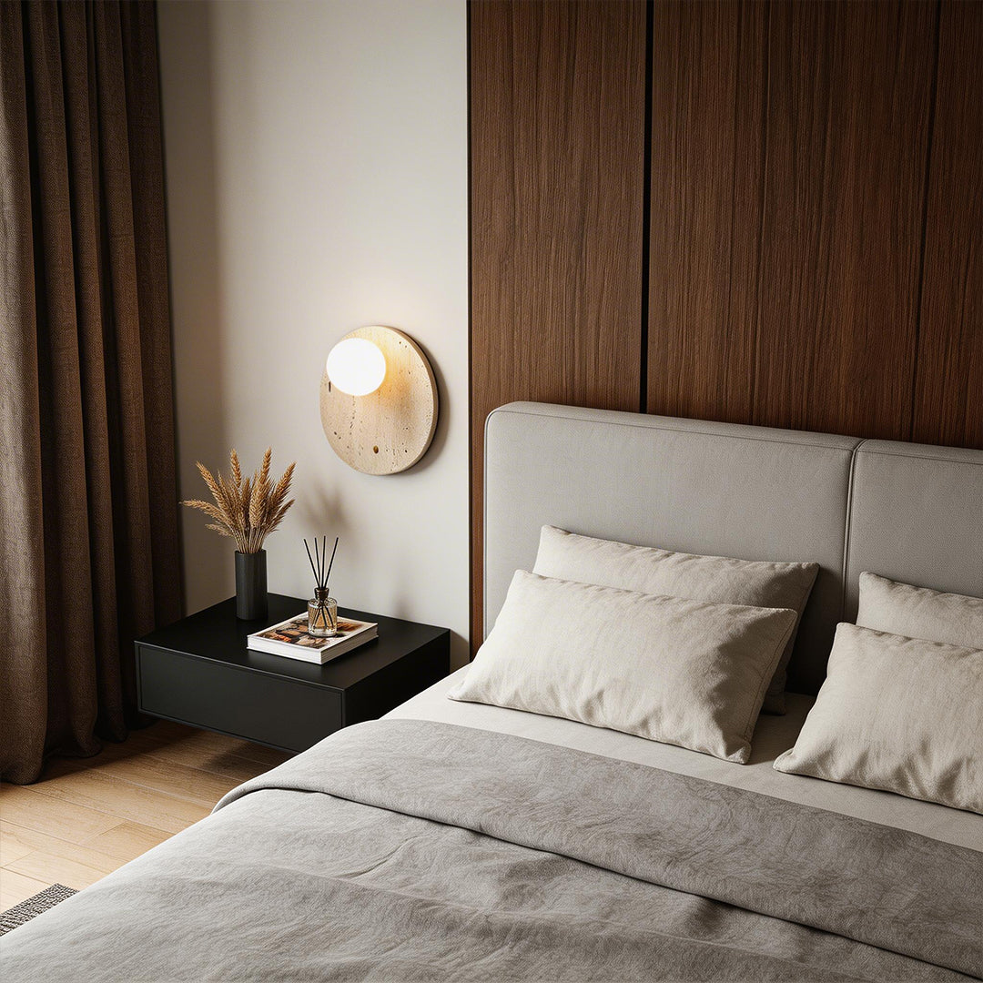 Ball wall lamp with a sleek wooden finish, enhancing a modern bedroom with warm light.