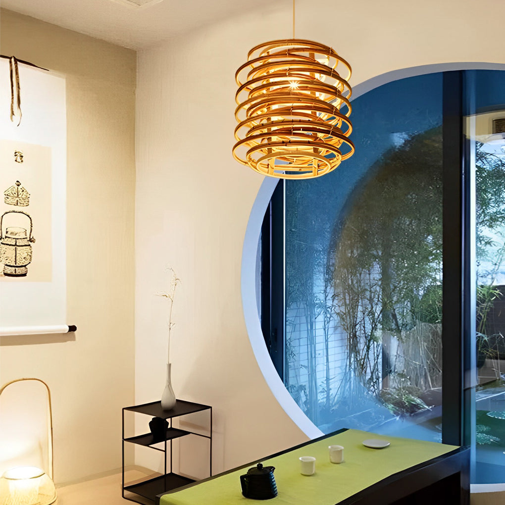 Bamboo pendant lights with a layered design, providing warm illumination in a cozy room.