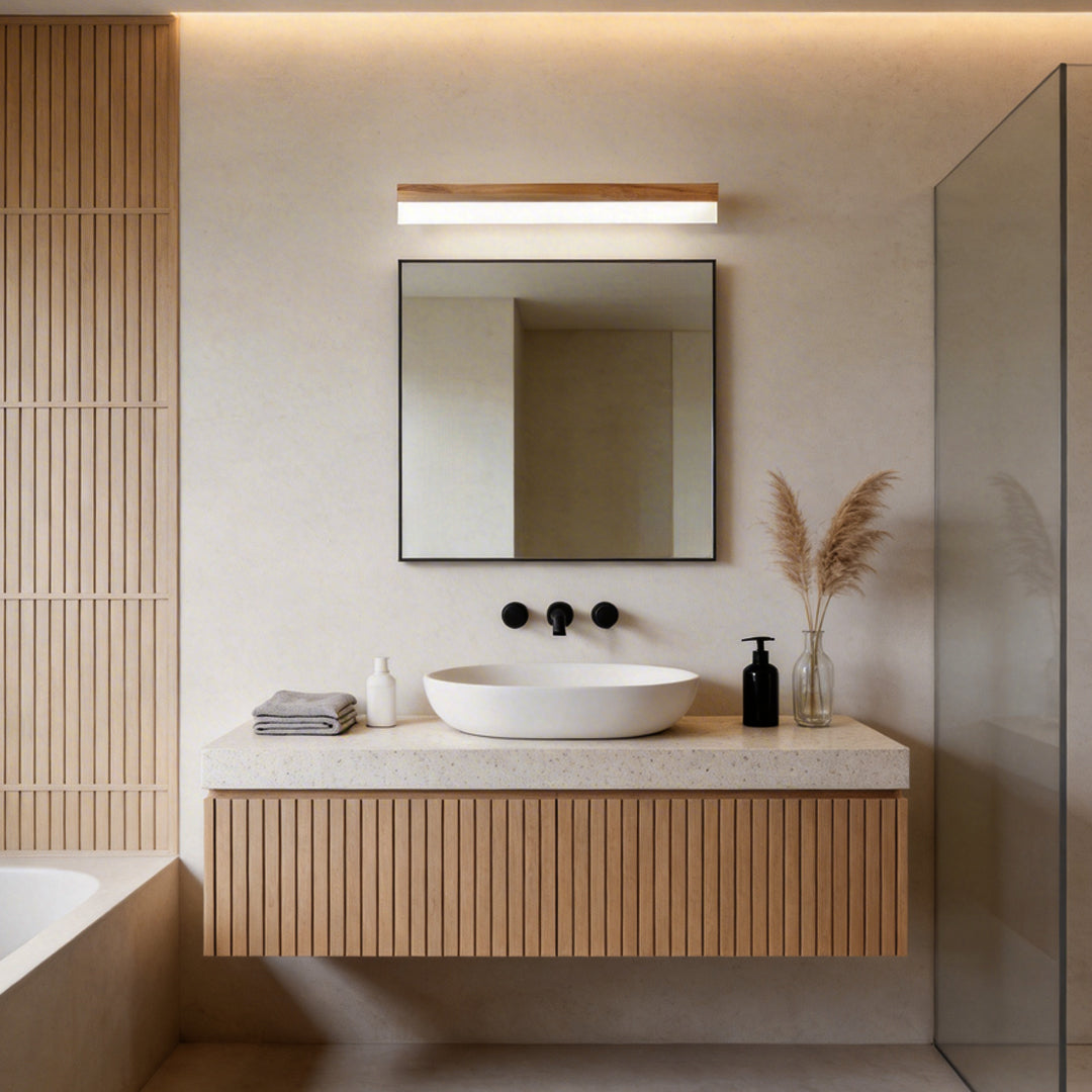 Bath bar vanity light with a minimalist design, enhancing a contemporary bathroom with wooden vanity.