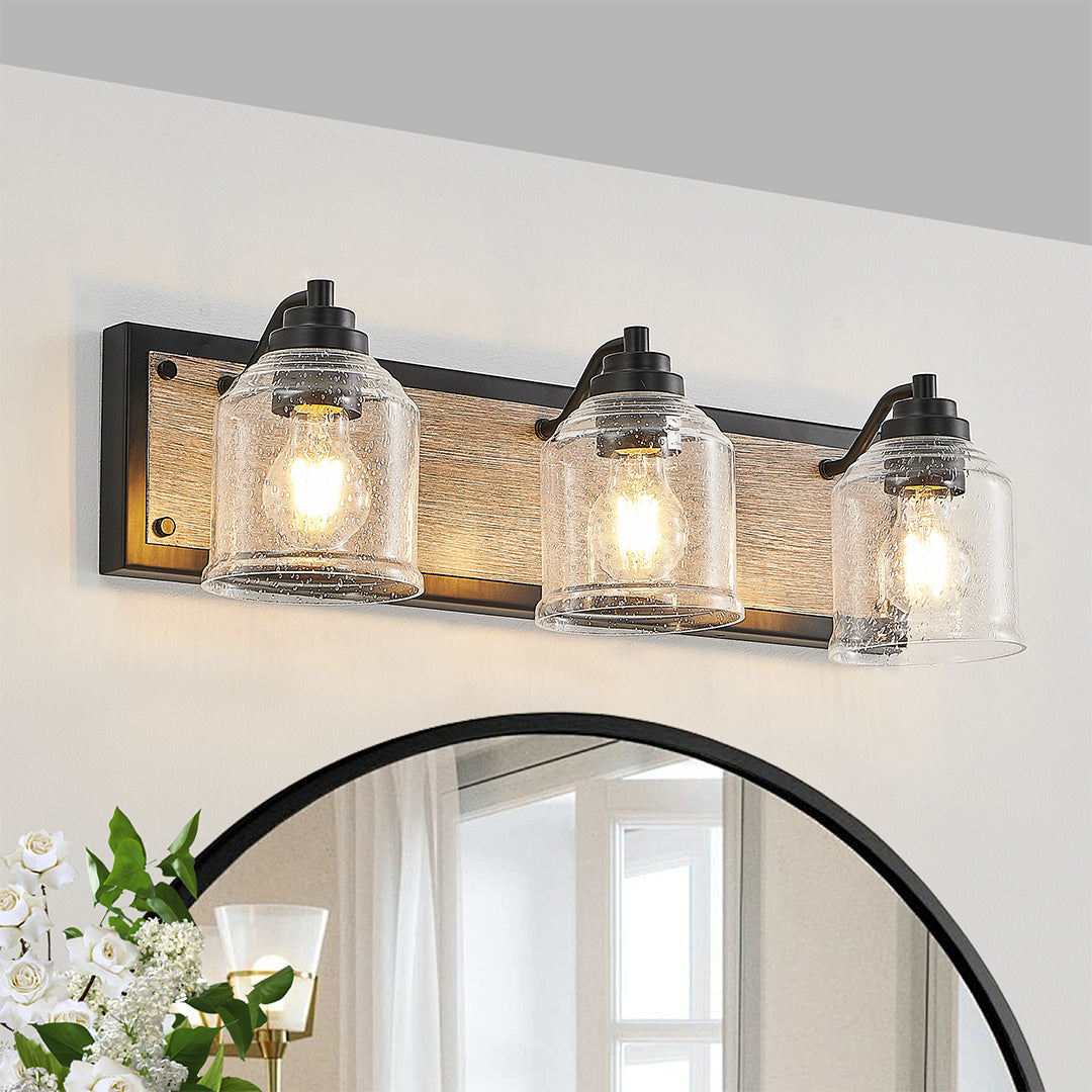 Multi-light wall sconce mounted above a bathroom mirror, enhancing the space with functional and decorative lighting.
