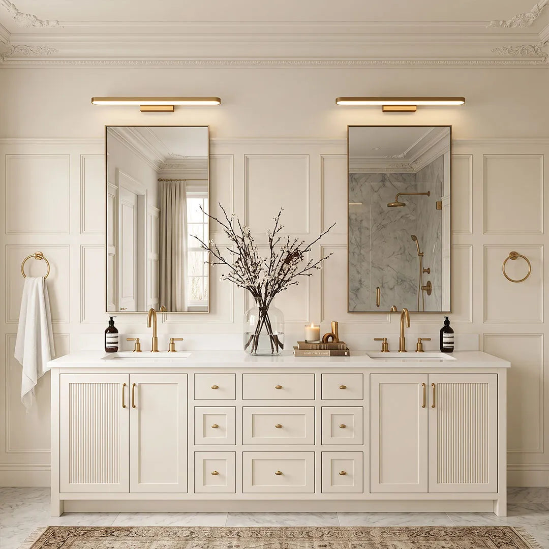 Bathroom vanity bar lights above dual mirrors in a bright white double-sink bathroom vanity.