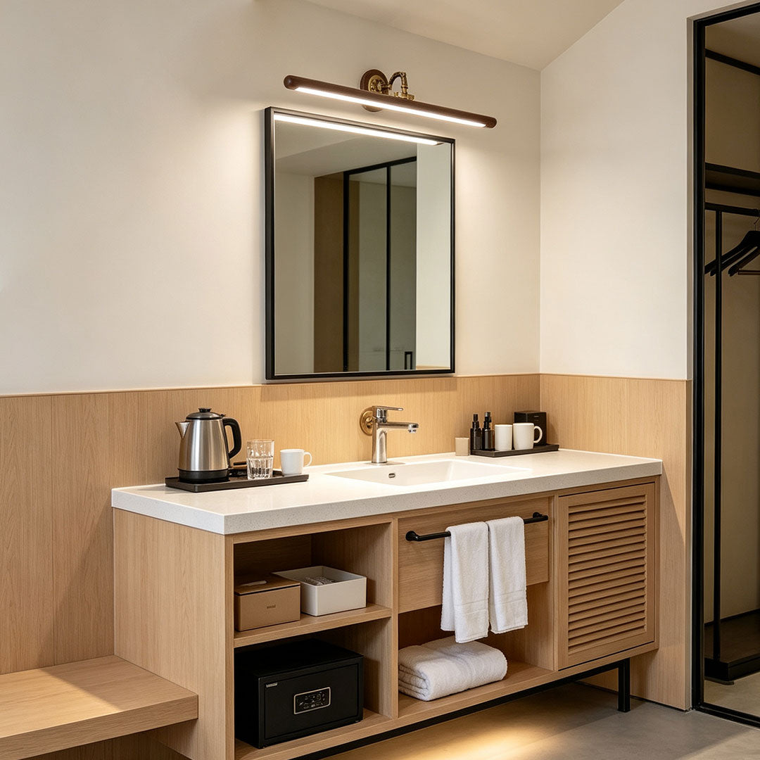 Bathroom vanity bar light fixtures installed above a bathroom mirror with warm ambient illumination.