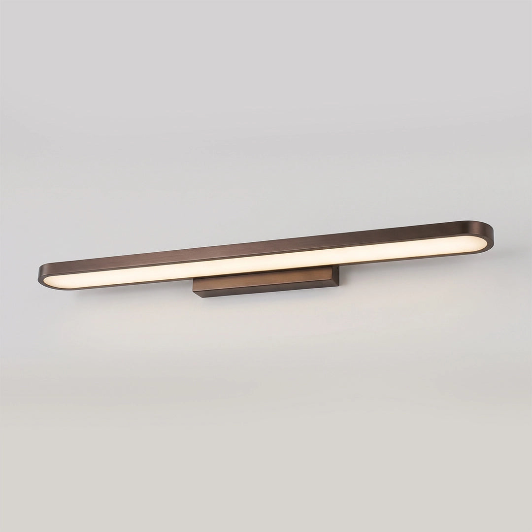 Illuminated bathroom vanity bar light with a slim bronze-toned frame and warm white linear glow.