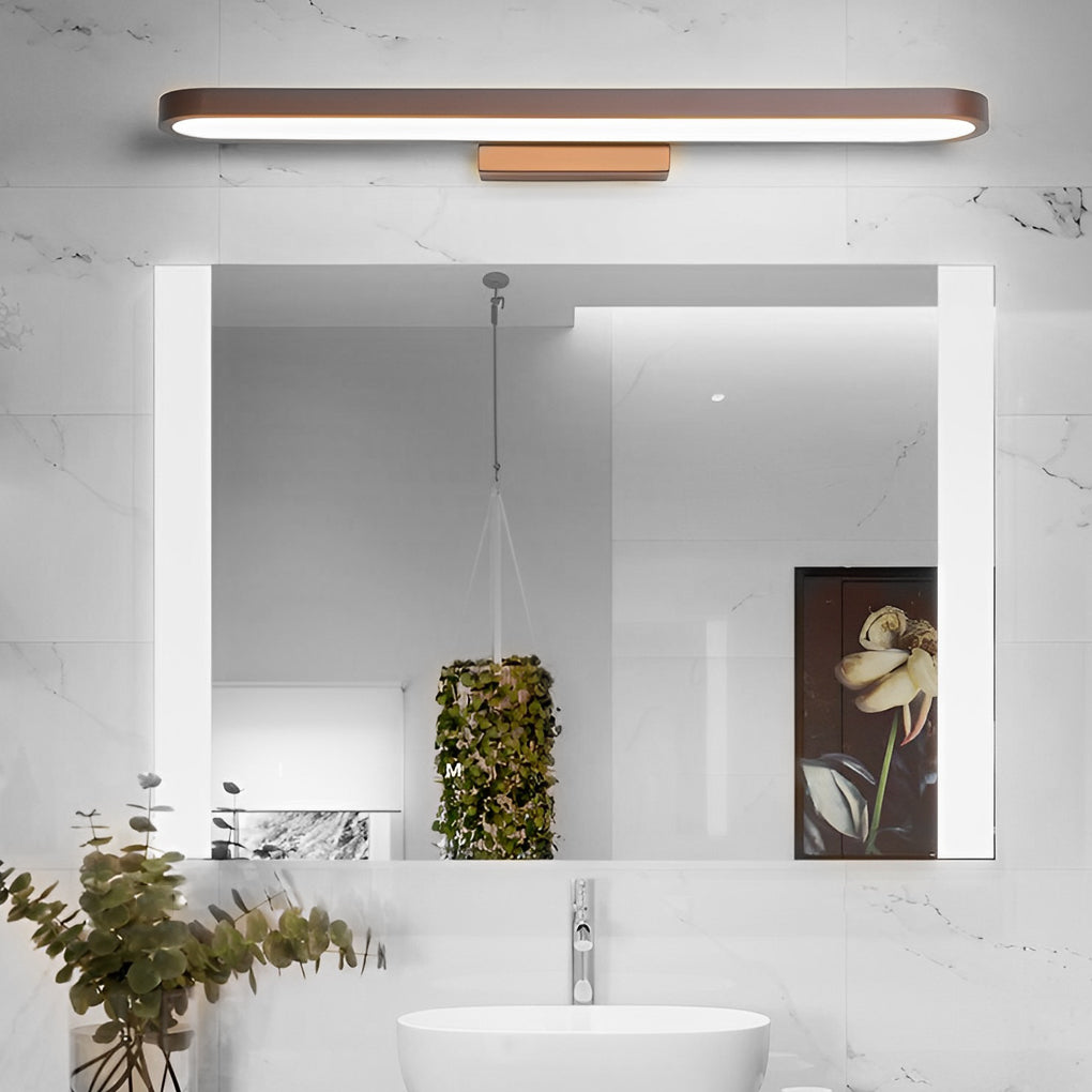 Minimalist vanity bar light mounted over bathroom mirror in a clean white interior