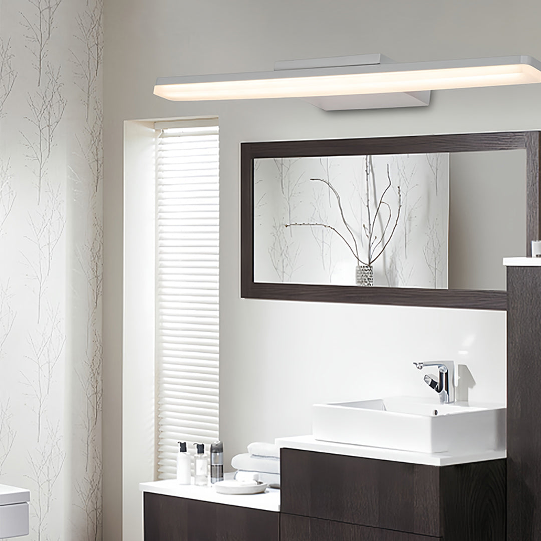 Contemporary bathroom with small black pendant light providing task lighting above vanity mirror