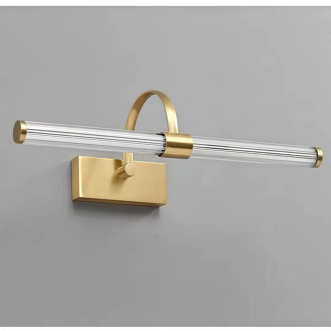 Bathroom vanity wall light in brass finish displayed on neutral grey background showing warm LED glow.