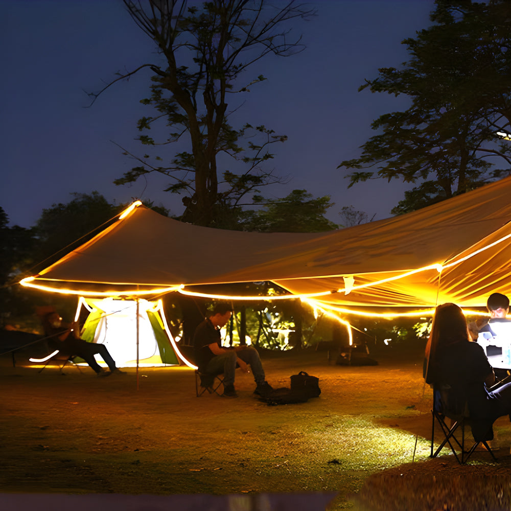 Battery powered LED light strips illuminating outdoor camping tent setup during nighttime