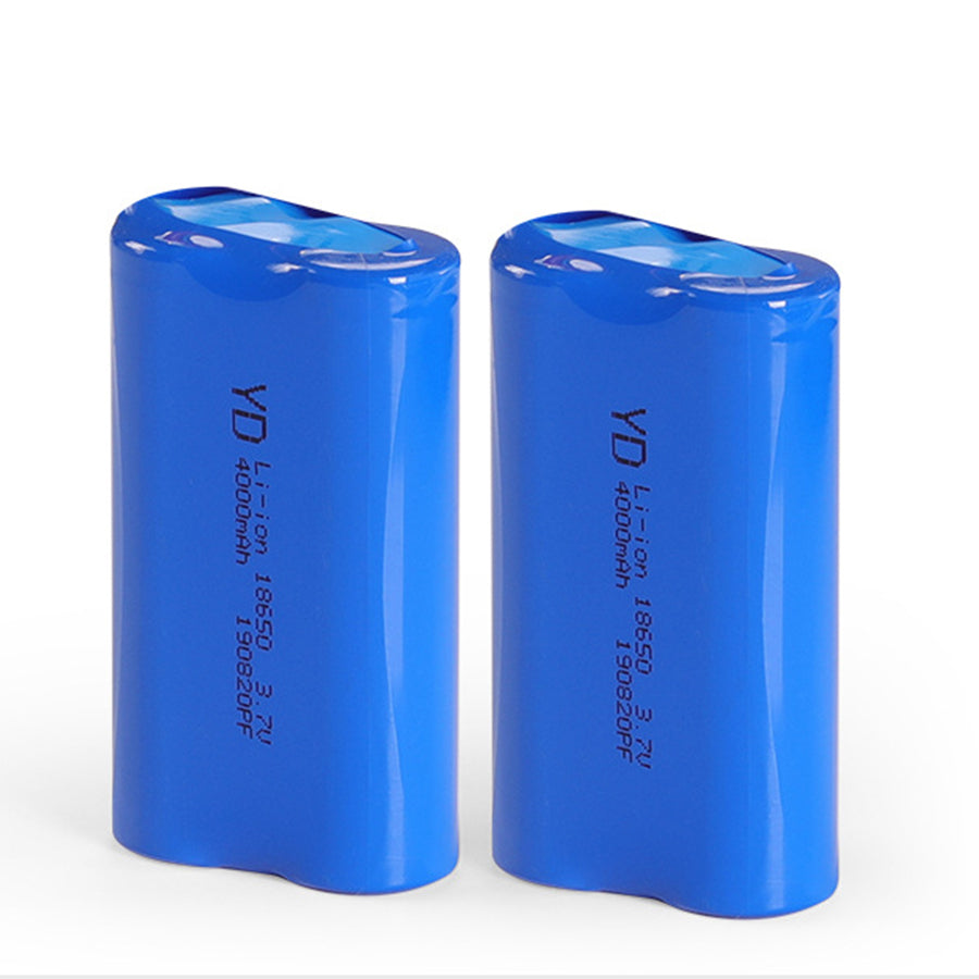 Tall solar pathway light with clean geometric design positioned along stone garden border