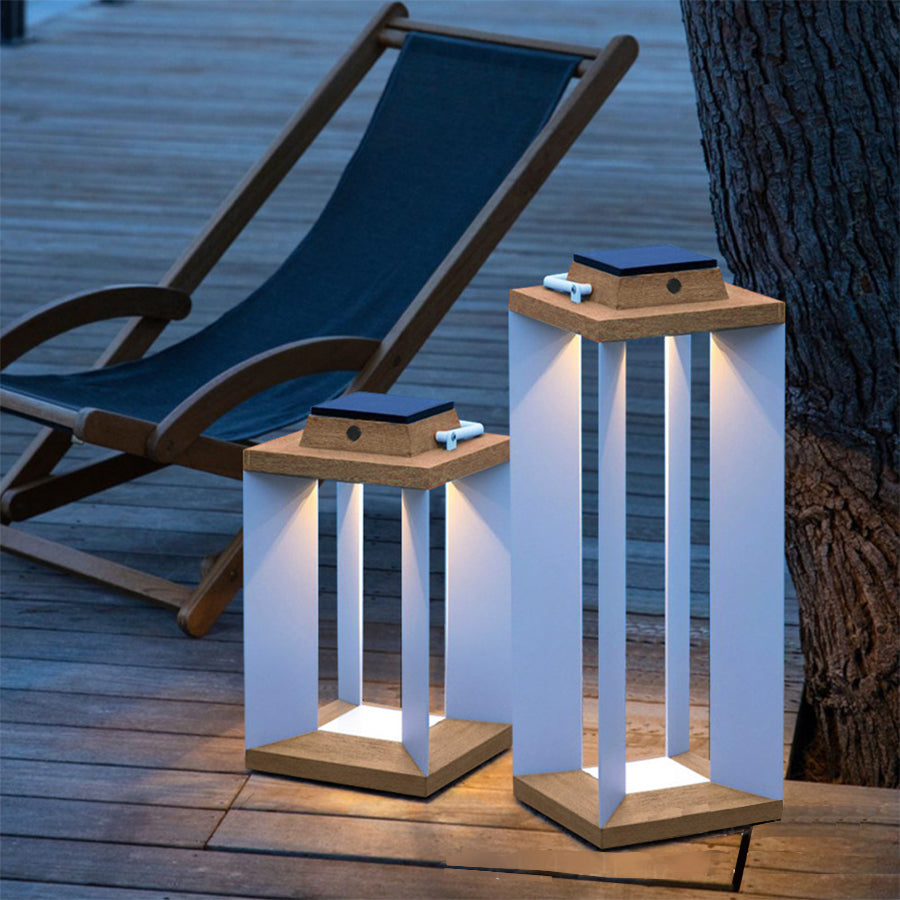 Two wooden solar lanterns positioned on deck chairs creating relaxing beachside evening atmosphere