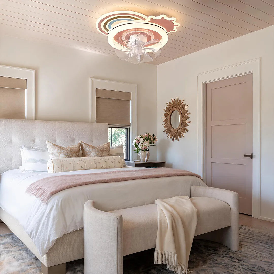 Beautiful ceiling fans with lights installed in a bright bedroom with soft pink and neutral decor.