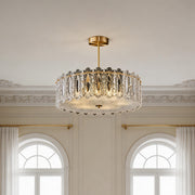 Beautiful glass semi flush mount lighting with a gold finish and vertical clear glass prisms.